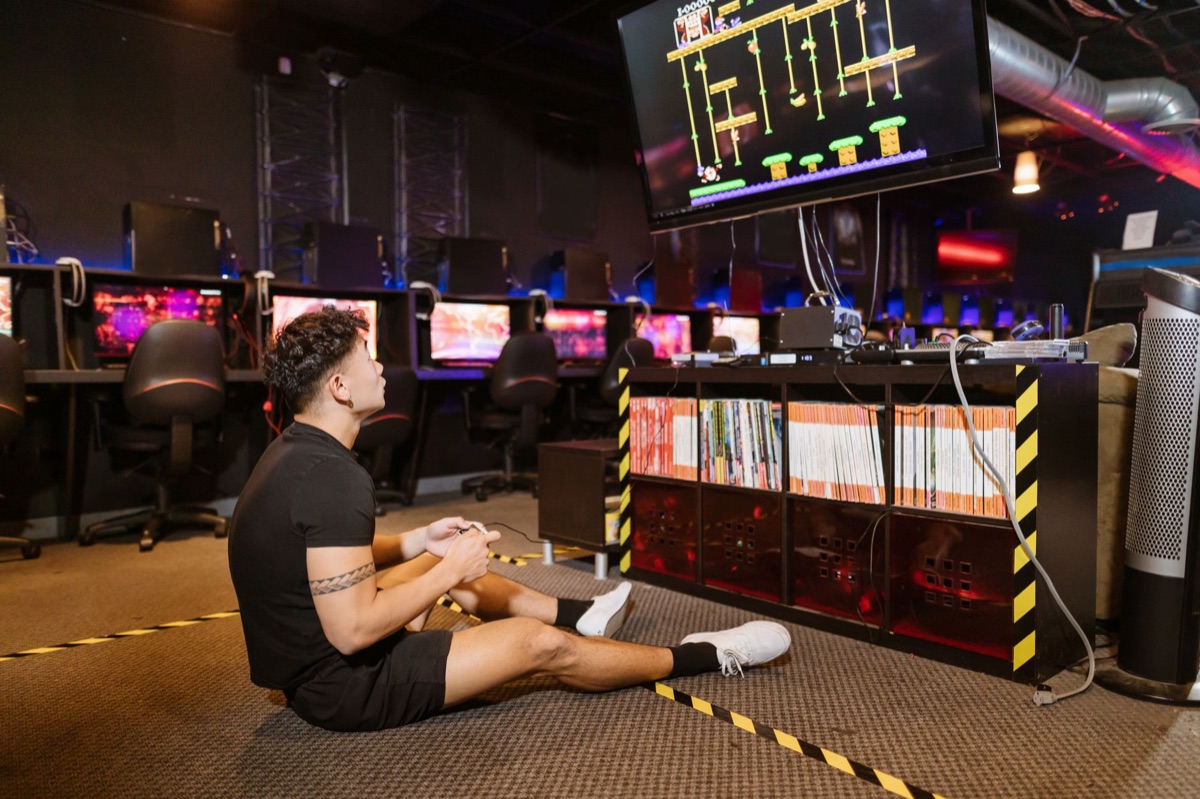gaming console and PC side by side in a living room