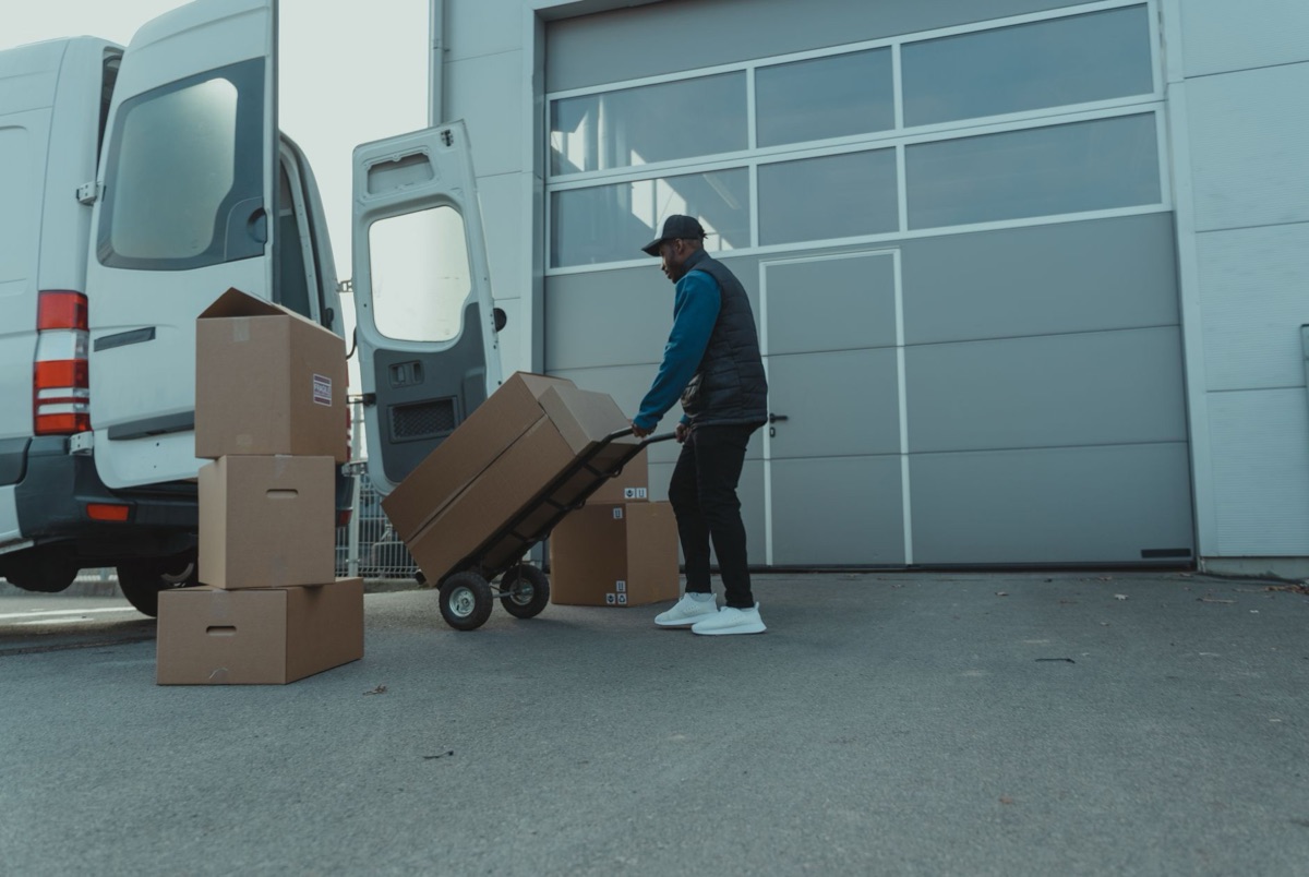 container truck unloading goods at UK port during trade adjustment